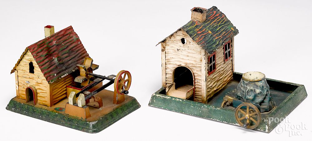 Appraisal: Two Doll painted tin mill steam toy accessories Two Doll