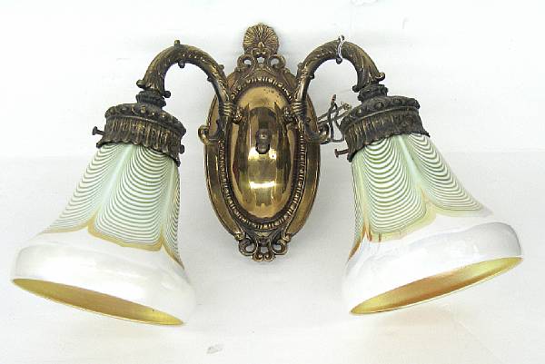 Appraisal: An American gilt metal two-light wall sconce with two art