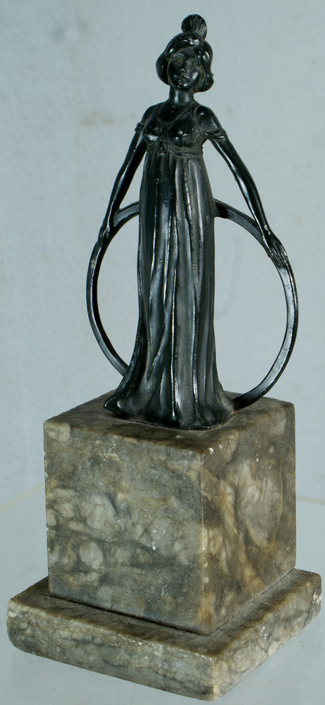 Appraisal: Patinated white metal sculpture of art nouveau lady holding a