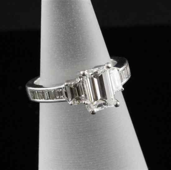 Appraisal: A platinum set emerald cut diamond ring the central stone