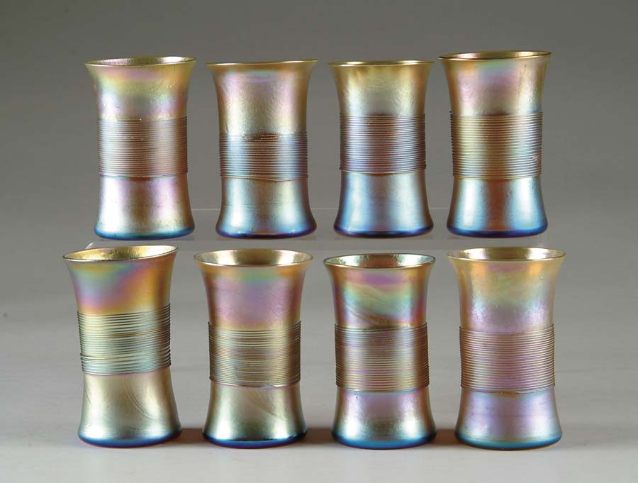 Appraisal: EIGHT TIFFANY APPLIED GLASS TUMBLERS Applied glass threading decorates this