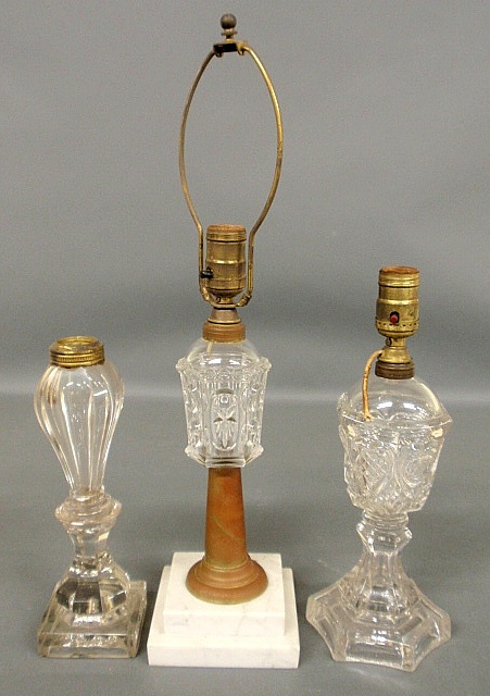 Appraisal: - Three clear glass whale oil lamps largest with a