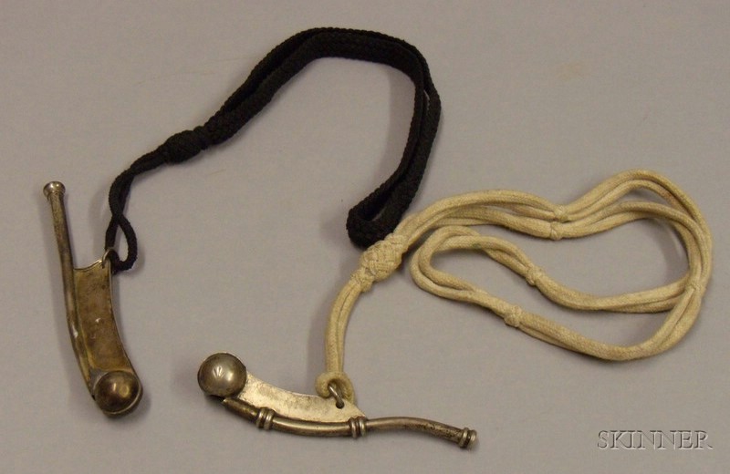 Appraisal: Two Navy Bosun's Whistles with Lanyards including one sterling silver