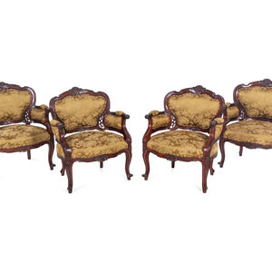 Appraisal: A Set of Four Rococo Style Upholstered Mahogany Armchairs Late