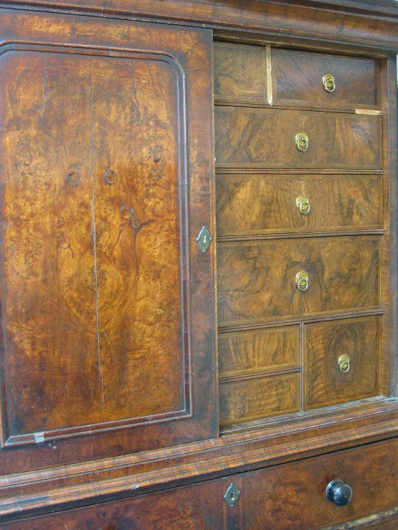 Appraisal: An early Georgian walnut Secretaire Chest the upper section having