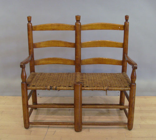 Appraisal: Maple love seat with rush bottom th c h l