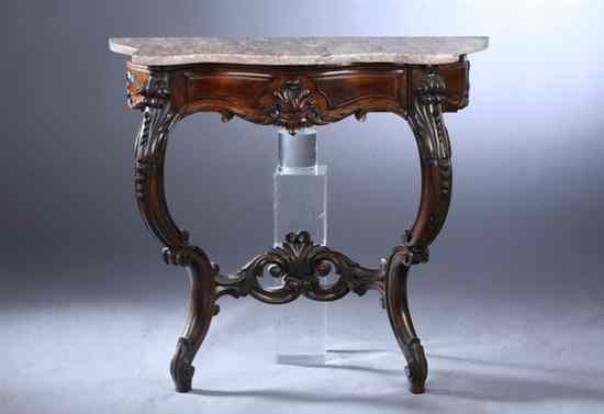 Appraisal: LOUIS XV STYLE CARVED MAHOGANY SERPENTINE-FRONT CONSOLE TABLE Marble top