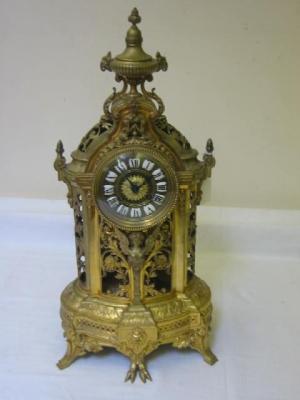 Appraisal: A FRENCH MANTEL CLOCK the eight day drum movement stamped