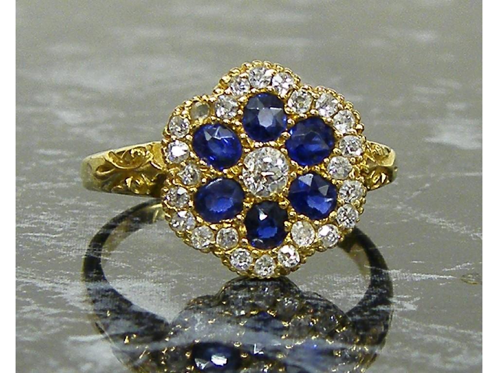 Appraisal: Attractive ct circular lobed sapphire and diamond cluster ring ct