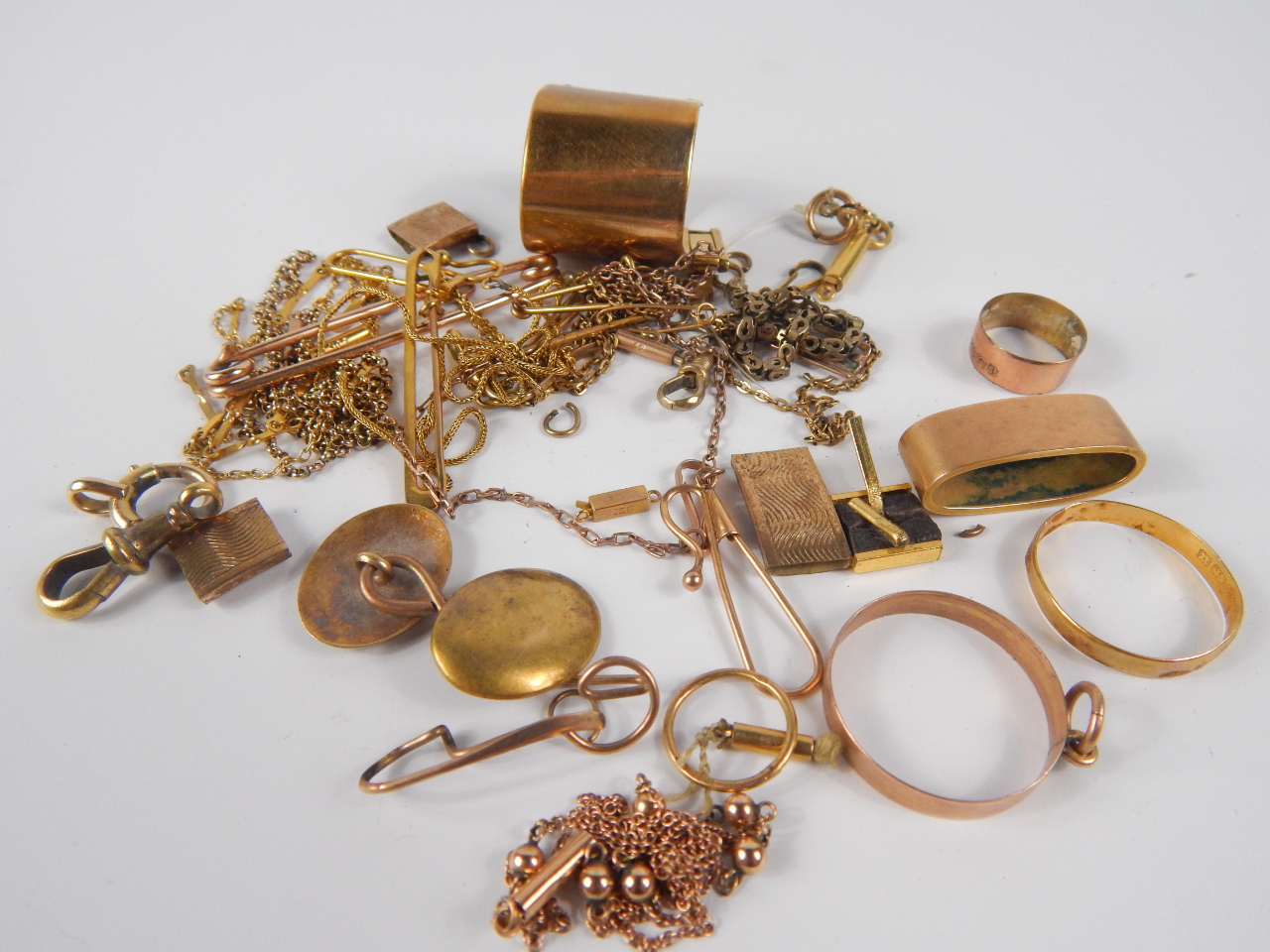 Appraisal: A collection of scrap gold and yellow metal including two