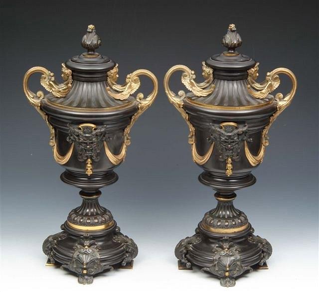 Appraisal: A PAIR OF TH CENTURY BLACK MARBLE AND BRONZE TWO