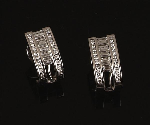 Appraisal: A pair of diamond ear clips each designed as a