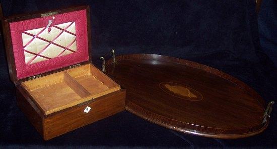 Appraisal: A mahogany oval tray inlaid a shell patera cm wide