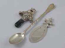 Appraisal: A child's silver rattle with two bells and moss agate