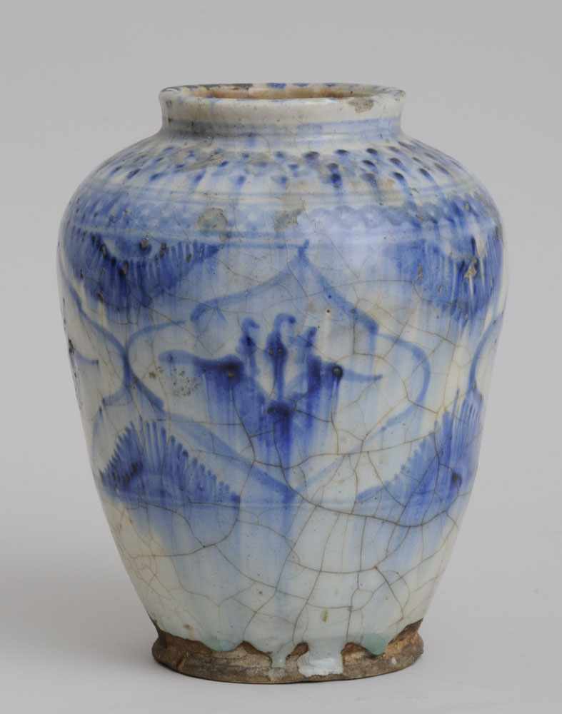 Appraisal: TURKISH BLUE AND WHITE POTTERY VASE The ovoid crackle-glazed bowl