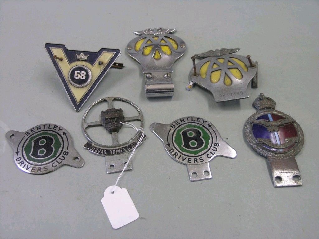 Appraisal: A small collection of car badges Jaguar's Driving Club Bentley