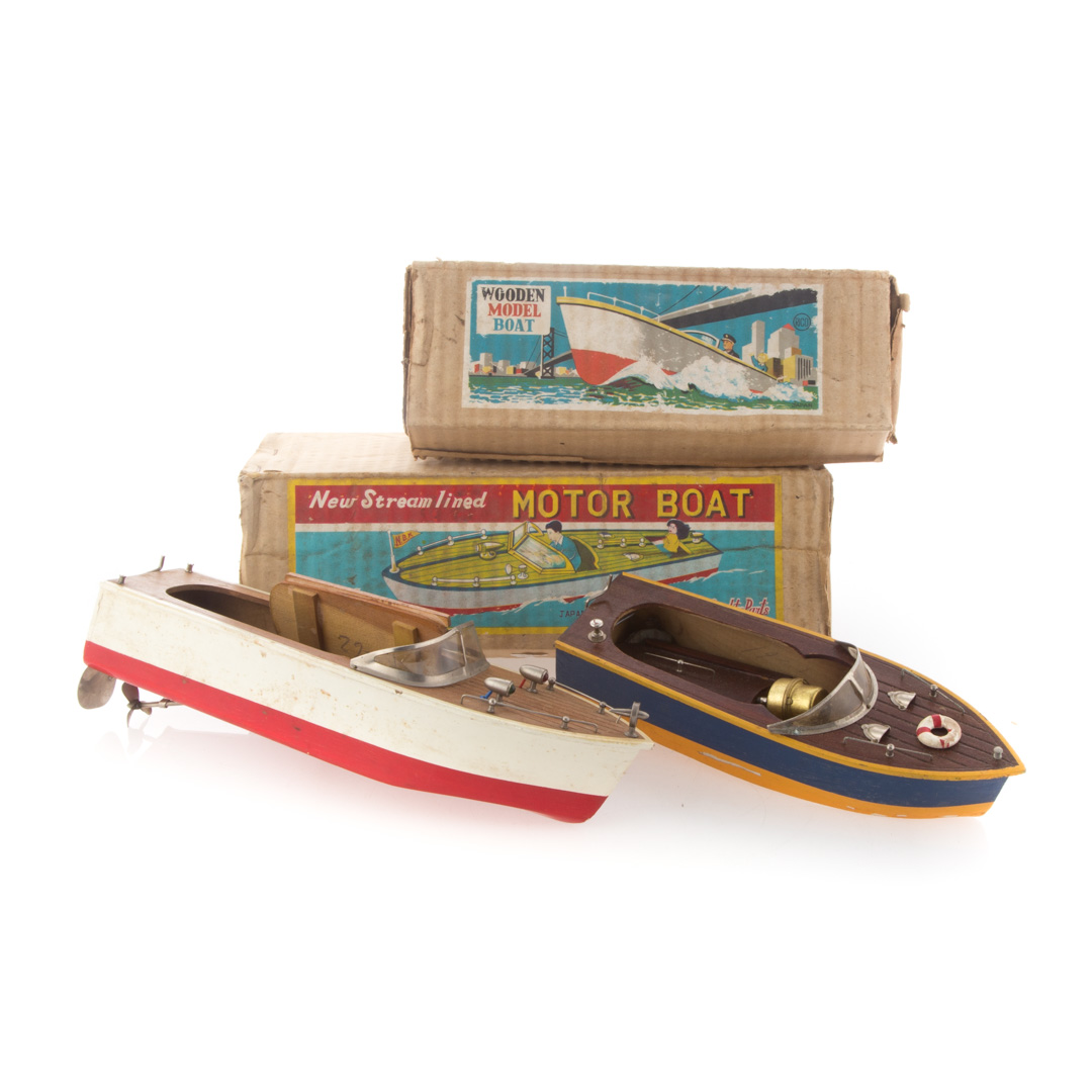 Appraisal: Two boxed wood boat toys