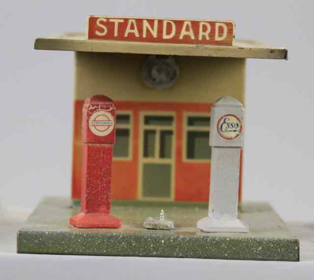 Appraisal: MARKLIN FUEL STATION Tin building with overhead roof fuel pumps