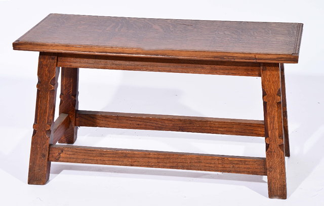 Appraisal: Cotswold SchoolRectangular oak low table having carved legs and rectangular