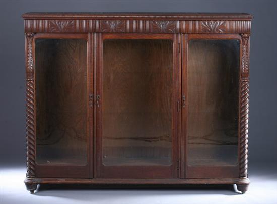 Appraisal: VICTORIAN OAK BOOKCASE CABINET late th Century Carved frieze turned