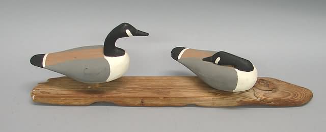 Appraisal: Pair of miniature geese standing on driftwood attributed to Peachy