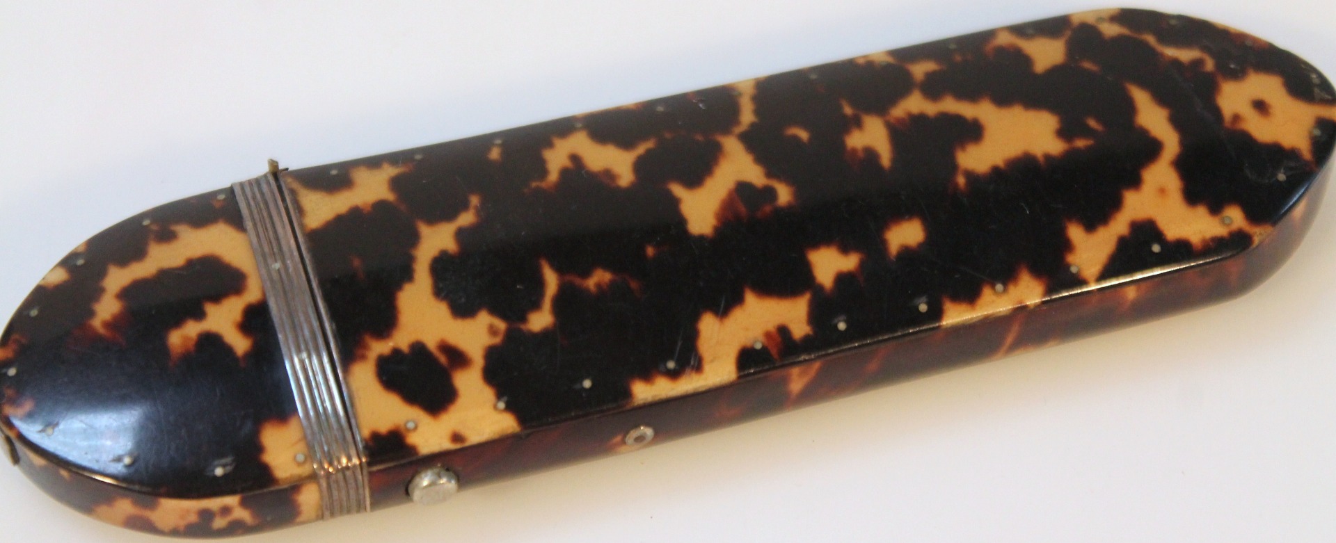 Appraisal: A late thC tortoiseshell and white metal spectacles case the