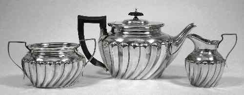 Appraisal: A late Victorian silver three piece tea service with squat