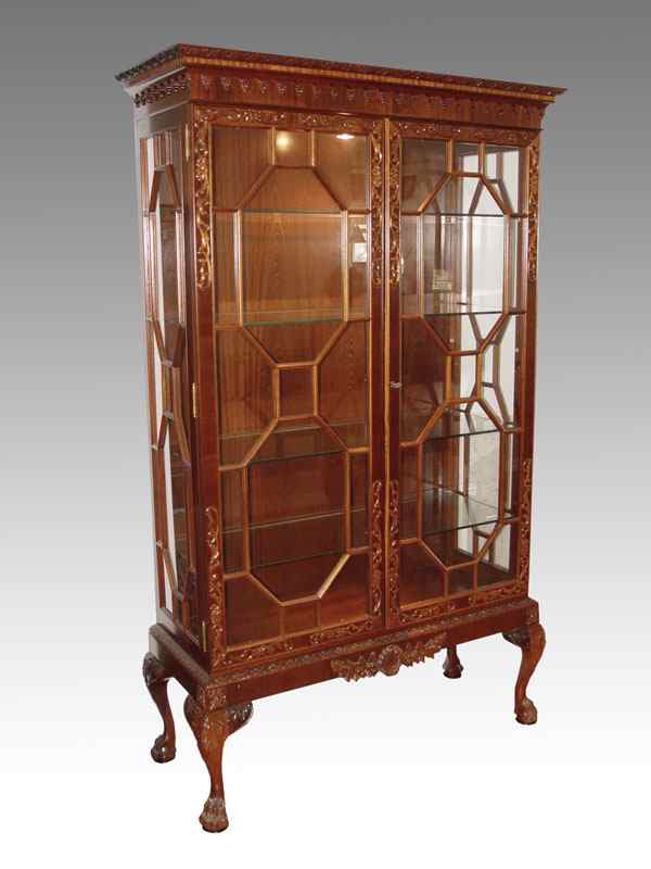 Appraisal: CHINESE CHIPPENDALE STYLE ORNATELY CARVED CURIO CHINA CABINET Profusely carved