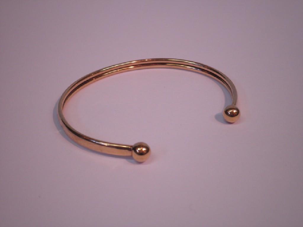 Appraisal: A ct gold slave bangle g