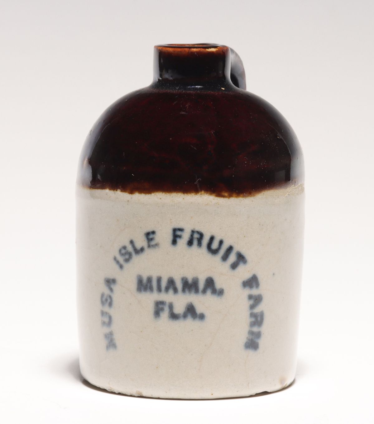 Appraisal: A MIAMI FLORIDA MUSA ISLE FRUIT FARM STONEWARE MINI JUGThe