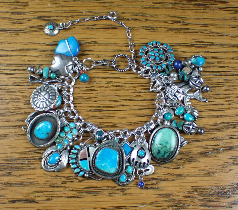 Appraisal: NATIVE AMERICAN STYLE SILVER CHARM BRACELET with an silver double