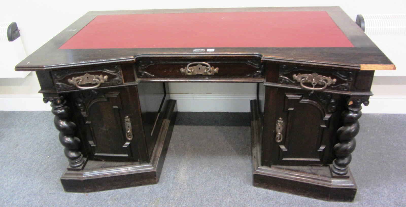 Appraisal: A stained carved oak Arts Crafts pedestal desk the inverted