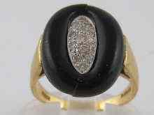 Appraisal: An carat gold onyx and diamond ring