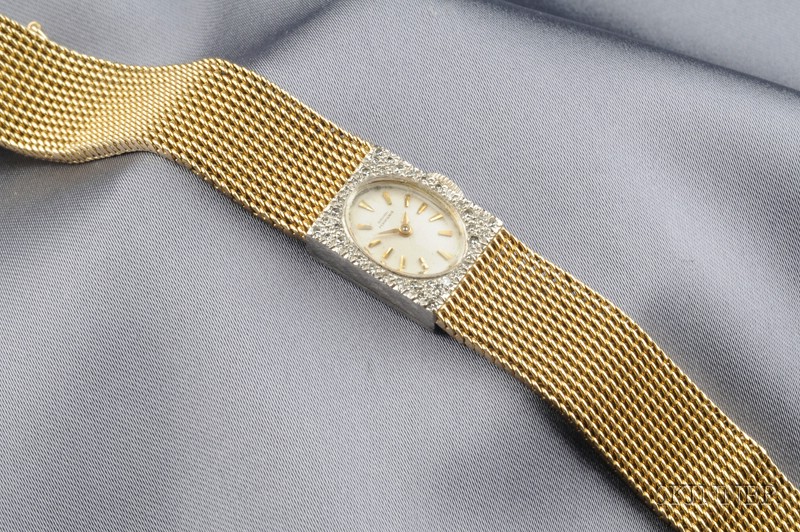 Appraisal: kt Bicolor Gold and Diamond Wristwatch Girard Perregaux the ivorytone