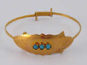 Appraisal: A yellow metal tests carat gold turquoise set child's bangle