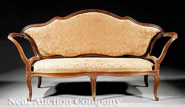 Appraisal: A Venetian Carved Walnut Sofa Frame th c arched molded