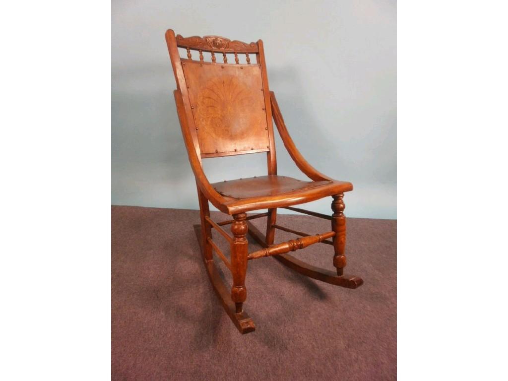 Appraisal: A late thC American type walnut rocking chair with stencil