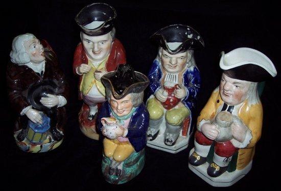 Appraisal: Four Toby jugs and another The Night Watchman cm high