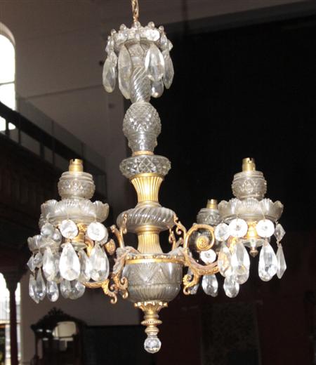 Appraisal: A gilt metal and cut glass four branch chandelier the