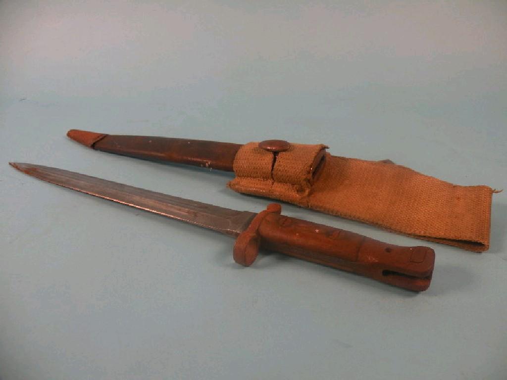 Appraisal: A British bayonet with a mahogany handle and part leather