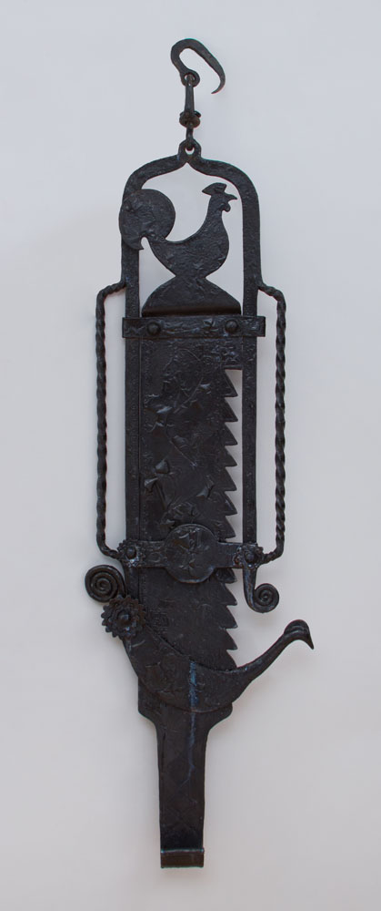 Appraisal: BLACK PAINTED WROUGHT-IRON TRAMMEL x in Ambassador and Mrs Joseph