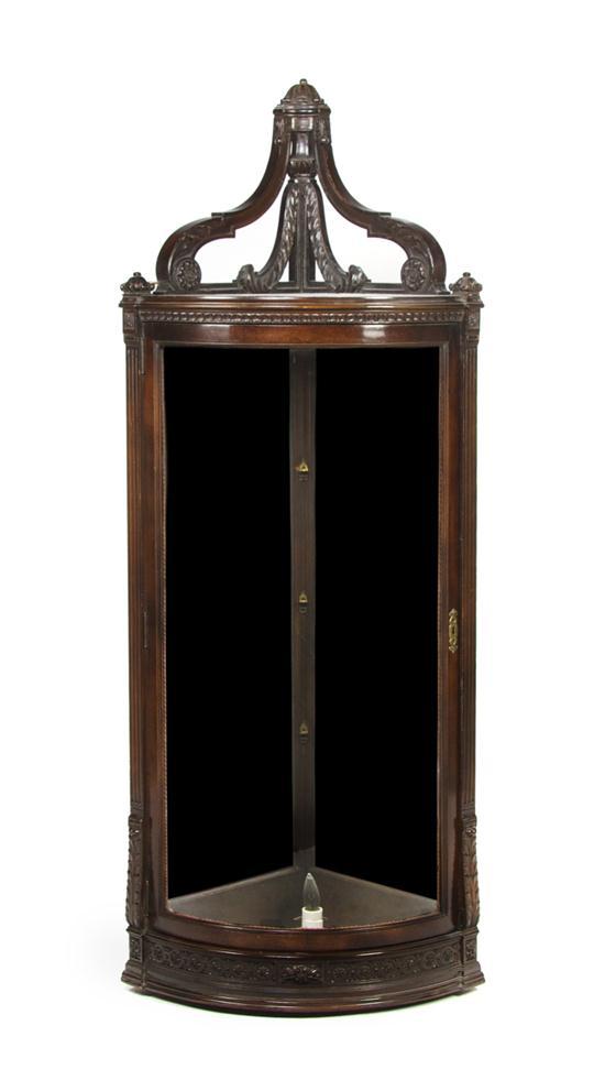 Appraisal: Neoclassical Carved Mahogany Hanging Corner Cabinet the single beveled glass