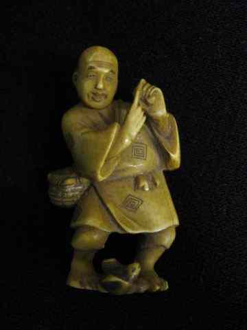 Appraisal: Carved Ivory Figurine of a Man basket offruit - ''