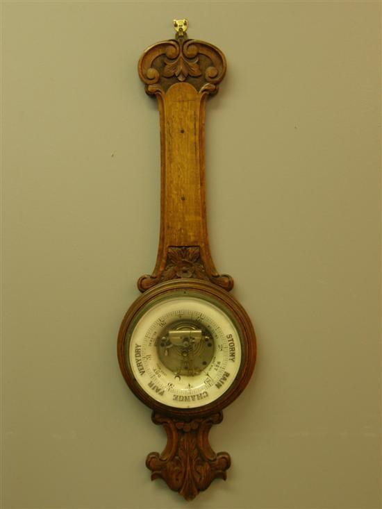 Appraisal: Early th century carved oak cased banjo barometer lacking thermometer