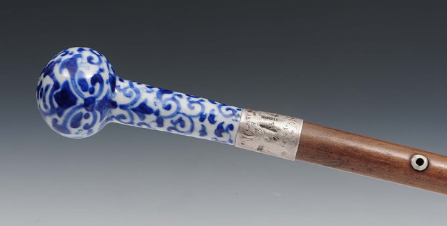 Appraisal: A Chinese blue and white porcelain cane handleearly th Centurydecorated