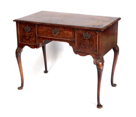 Appraisal: A Queen Anne style mahogany dressing table the rounded rectangular