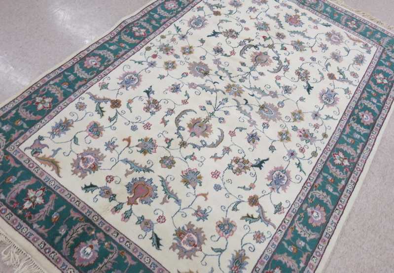 Appraisal: HAND KNOTTED ORIENTAL CARPET Indo-Persian floral Isfahan pattern on cream