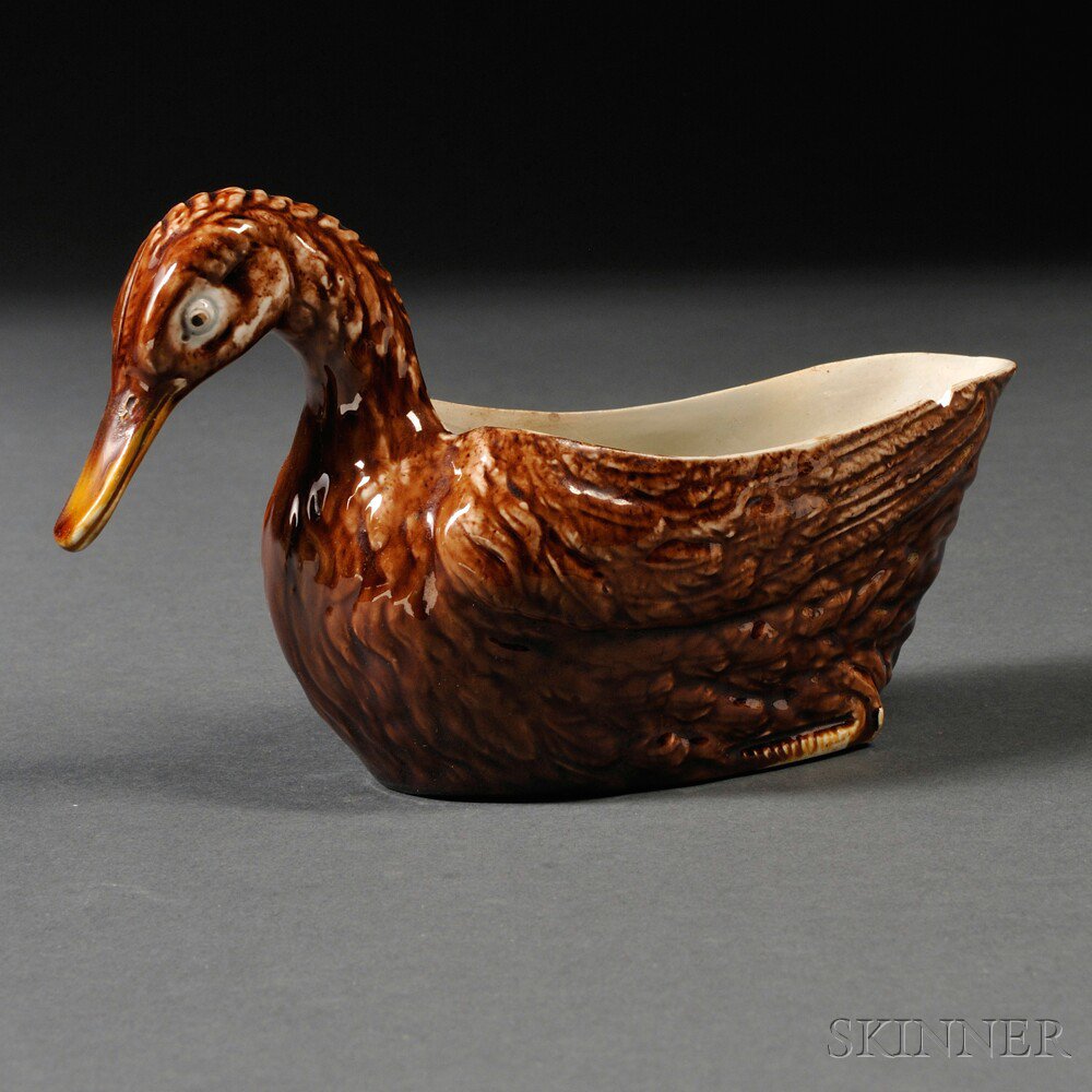 Appraisal: Staffordshire Cream-colored Earthenware Duck-form Sauceboat England c allover brown glaze