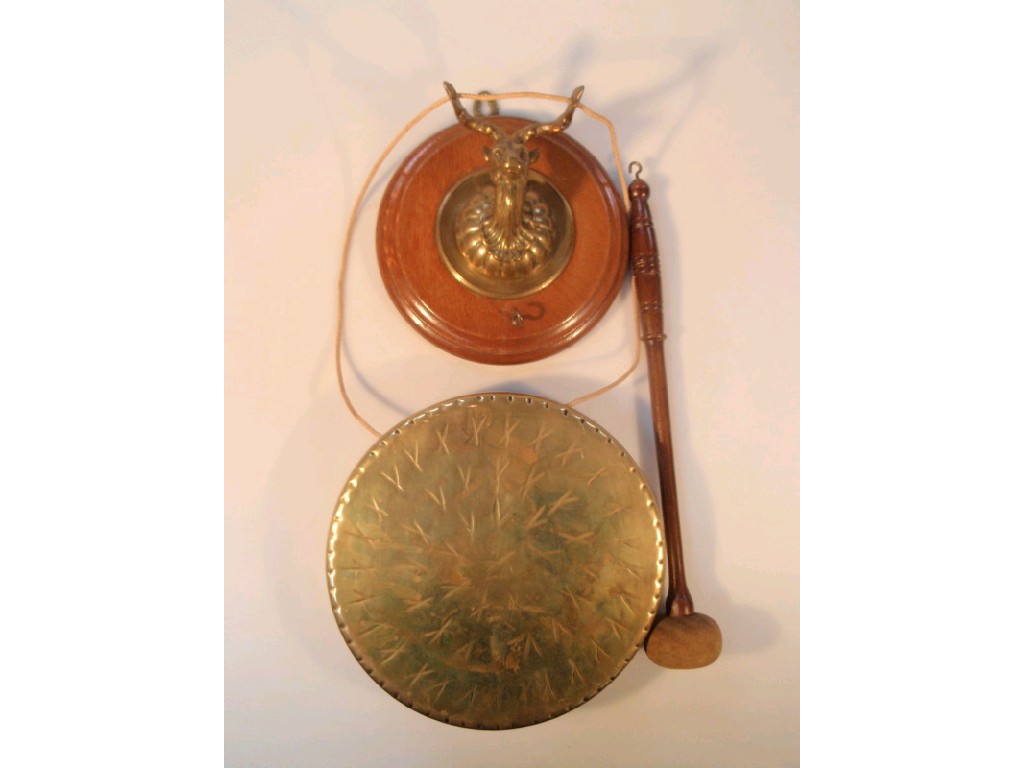 Appraisal: An early thC oak and brass wall mounted dinner gong