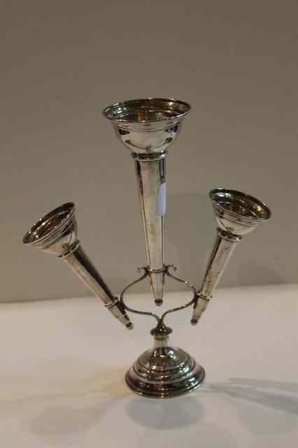 Appraisal: A SILVER THREE BRANCH EPERGNE of stylised form on circular